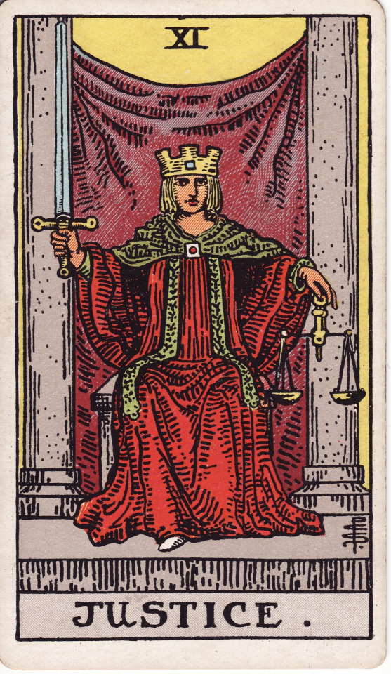 illustration of a figure representing Justice, dressed in a red robe with a crown holding a scale and a sword, from the Rider-Waite tarot card deck